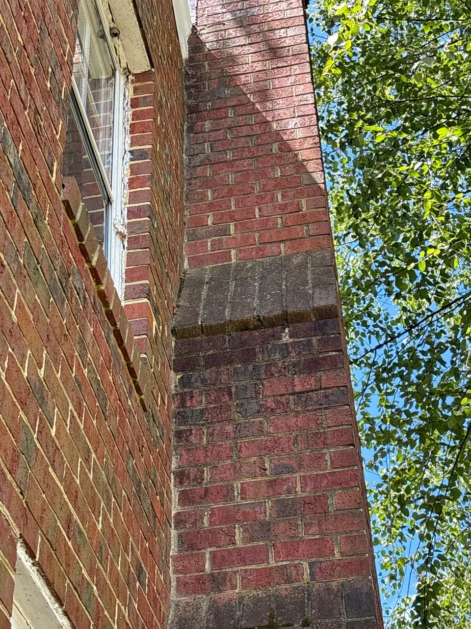 Close view of exterior chimney brickwork and mortar joints