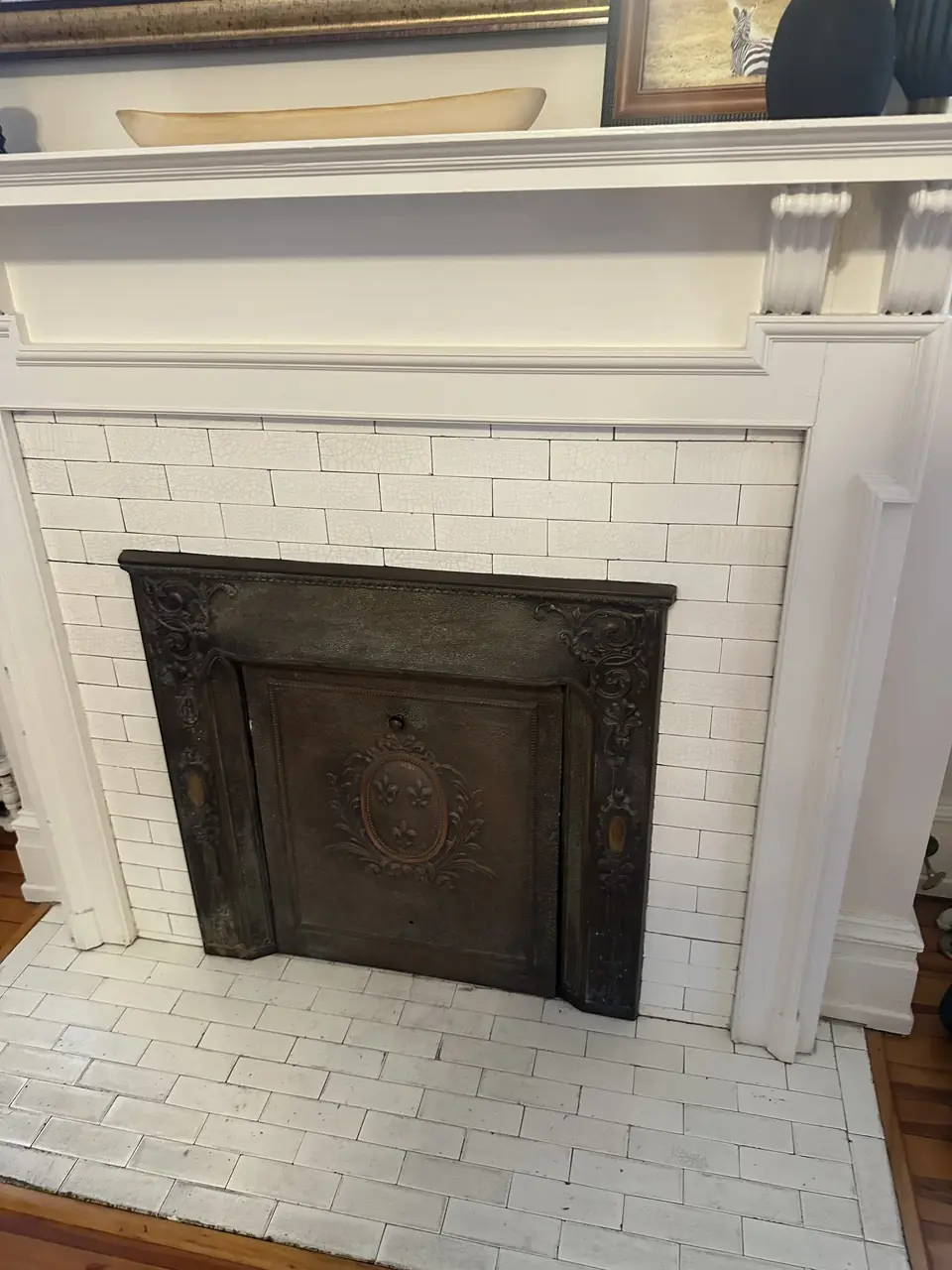 Painted fireplace with a white mantel and a clean firebox