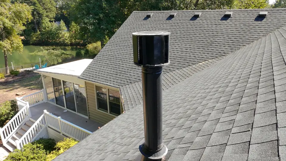 Roof exhaust vent on an asphalt shingle roof